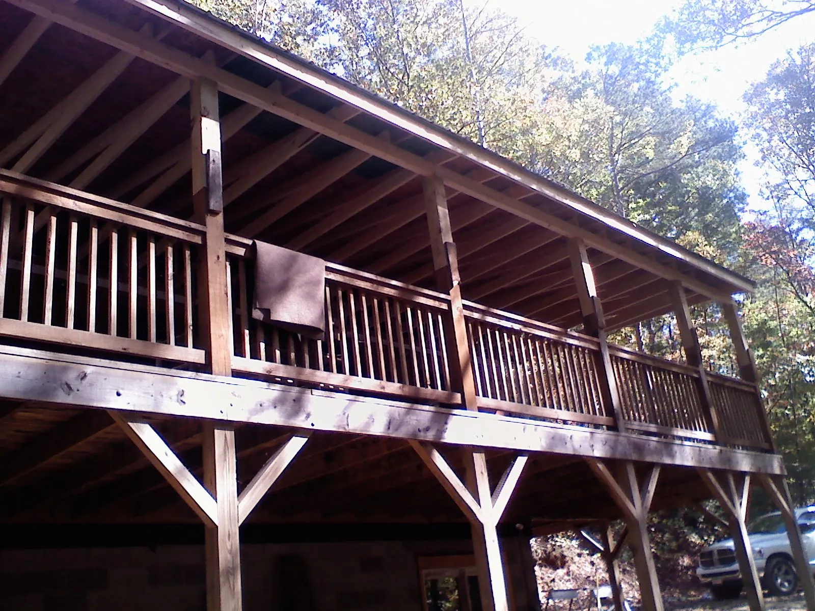 Timber framing under a new elevated porch and deck — Roof Leak Repair in Lander by Roofing Brothers